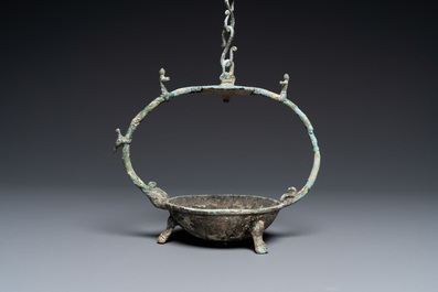 A Vietnamese bronze oil lamp with complete suspension chain, Dong Son, ca. 3rd/1st C. BC