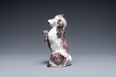 A Brussels faience manganese and white dog, 18th C.