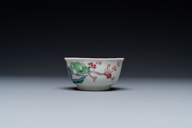 A Chinese famille rose cup and saucer with a couple on a terrace, Qianlong