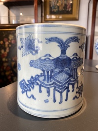 A Chinese blue and white brush pot with a landscape and antiquities, Kangxi