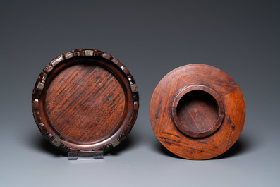 A Chinese famille verte vase and a famille rose vase with wooden cover and stand, 19th C.