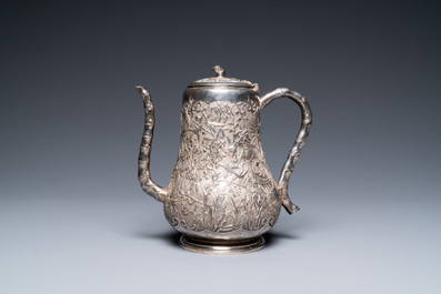 A Chinese silver teapot with birds among blossoming branches, 19th C.