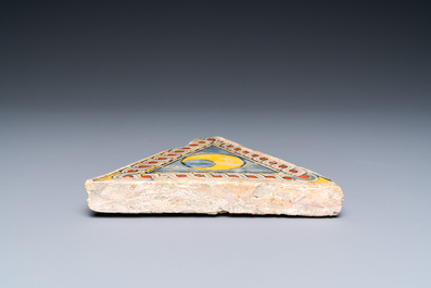 An Italian maiolica triangular floor tile, Faenza, 15/16th C.