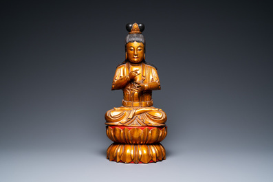 A large Vietnamese or Japanese gilded and lacquered wooden Buddha on lotus throne, 19th C.