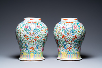 A pair of Chinese famille rose vases with wooden covers and stands, 19th C.