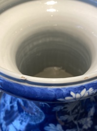 A pair of Chinese blue and white 'dragon and peony' vases, 19th C.