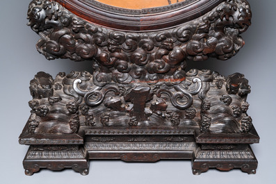 A pair of Chinese wooden table screens with soapstone- and bone-embellished medallions, 18/19th C.