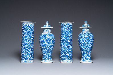 A Chinese blue and white four-piece garniture, Kangxi mark, 19th C.