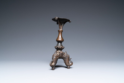 A Chinese bronze candlestick, Ming