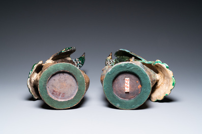 A pair of large Chinese polychrome pottery peacocks on tree trunks, Shiwan, 19th C.