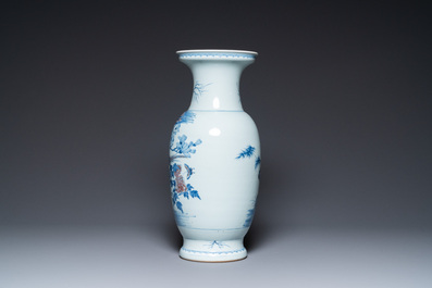 A Chinese blue, white and copper-red vase, 18/19th C.