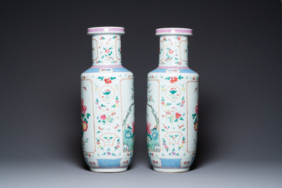 A pair of Chinese famille rose rouleau vases, 19th C.