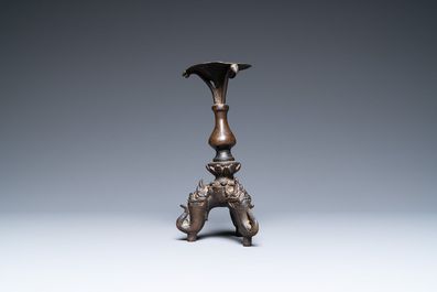 A Chinese bronze candlestick, Ming