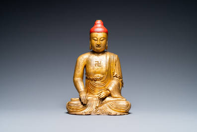 A Vietnamese or Japanese gilded and lacquered wooden Buddha, 19th C.