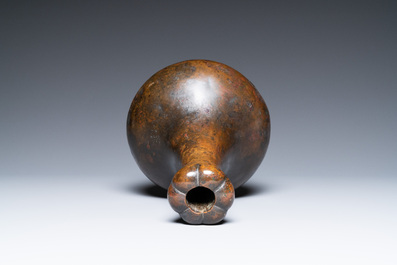 A Chinese bronze garlic-head 'hu' wine vessel, Eastern Zhou/Han