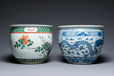 A Chinese blue and white 'dragons' fish bowl and a famille verte 'magpies' fish bowl, 19th C.