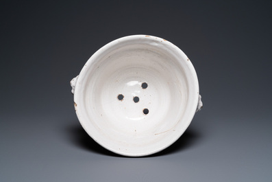 A large monochrome white-glazed French faience fruit bowl, dated August 1770