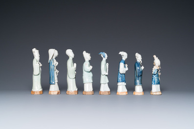 Eight Chinese blue, white and celadon-glazed figures, Qianlong