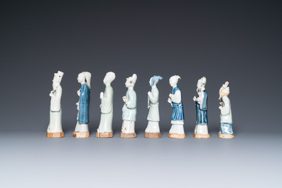 Eight Chinese blue, white and celadon-glazed figures, Qianlong