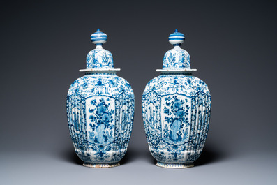 A pair of large ribbed Dutch Delft blue and white covered vases, 1st quarter 18th C.