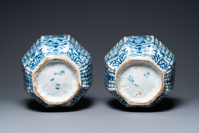 A pair of large ribbed Dutch Delft blue and white covered vases, 1st quarter 18th C.