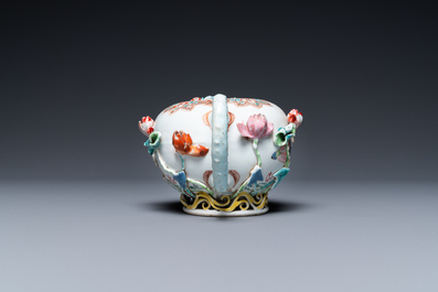 A Chinese famille rose teapot with applied floral design, Yongzheng