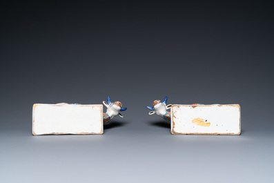 A pair of polychrome Dutch Delft cows on bases with frogs, 18th C.