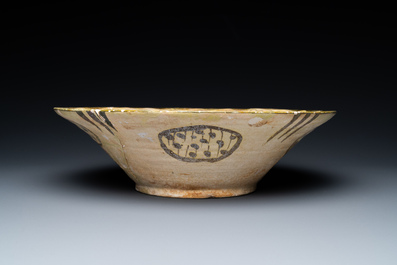 A large Nishapur 'imitation lustre' pottery bowl with a bird, Persia, 10th C.