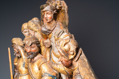 A polychromed walnut wood retable fragment depicting soldiers, Spain, 1st half 16th C.