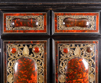 A tortoise veneer, gilt copper, ebony and ebonised wooden mirrored interior cabinet on stand, Antwerp, 17th C.