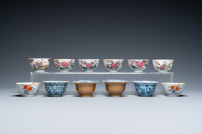 Twenty-two Chinese blue and white and famille rose cups and nineteen saucers, Kangxi and later