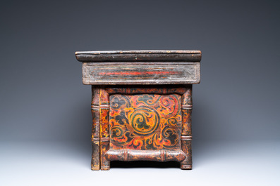 A Tibetan painted and lacquered wooden altar stand, 18th C.