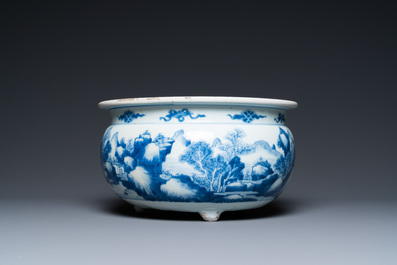 A Chinese blue and white 'landscape' tripod censer with later wooden cover and stand, Kangxi