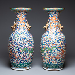 A pair of large Chinese famille rose 'dragon' vases, 19th C.