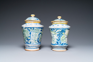 A pair of polychrome Italian maiolica covered albarelli with 'a trofei' design, Casteldurante, dated 1576