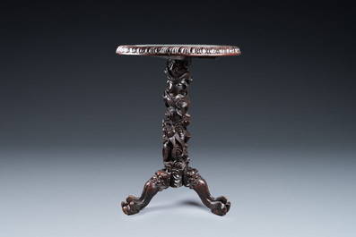 A Chinese wooden table with a Canton famille rose plaque, 19th C.