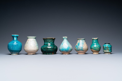 Une collection de sept vases et verseuses en c&eacute;ramique &agrave; &eacute;mail turquoise, Moyen-Orient, 13&egrave;me et apr&egrave;s