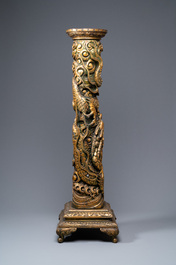 A large Chinese gilded wooden 'dragon' stand, 19th C.