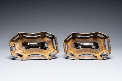 A pair of Chinese bronze deer-shaped candlesticks, Kangxi/Qianlong