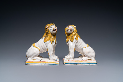 A pair of polychrome French faience lions, Rouen, 1st half 18th C.