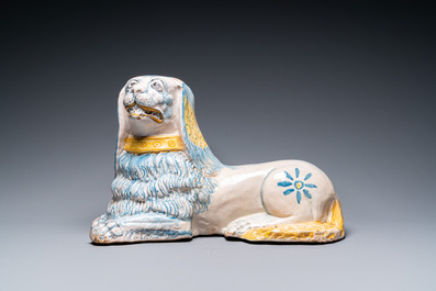 A large blue, white and yellow model of a recumbent lion, Nevers, France, 17th C.