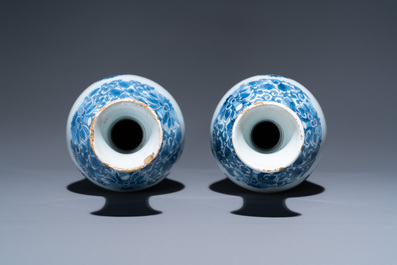 A pair of Dutch Delft blue and white bottle vases with floral design, late 17th C.