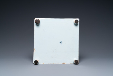 A Dutch Delft blue and white square footed tray on ball feet with chinoiserie design, late 17th C.