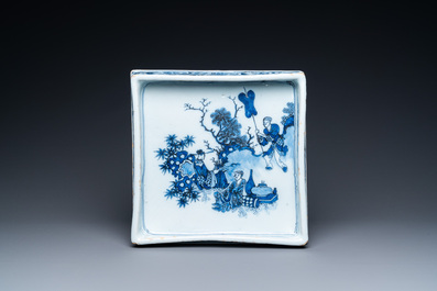 A Dutch Delft blue and white square footed tray on ball feet with chinoiserie design, late 17th C.