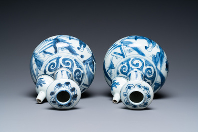 A pair of Chinese blue and white kendi depicting a figure in a landscape, Wanli