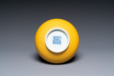 A Chinese monochrome yellow-glazed bottle vase with incised dragon design, Daoguang mark, 19/20th C.