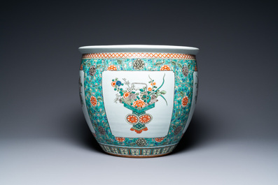 A pair of Chinese famille verte powder blue-ground vases and a fish bowl, 19th C.