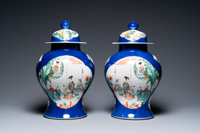 A pair of Chinese famille verte powder blue-ground vases and a fish bowl, 19th C.