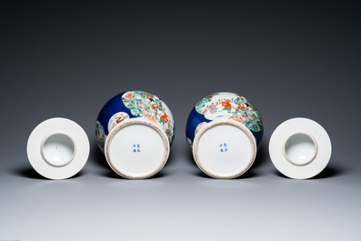 A pair of Chinese famille verte powder blue-ground vases and a fish bowl, 19th C.