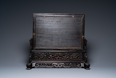 A Chinese rectangular famille rose 'landscape' plaque mounted in a wooden table screen, 19/20th C.